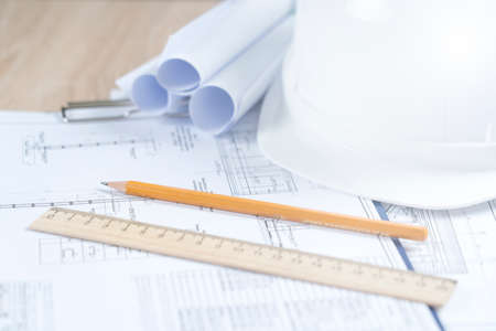 helmet and tools for construction drawings and construction drawings close-up