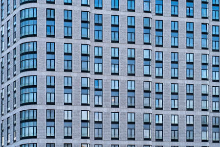 facade of a modern office residential building against the sky,の写真素材