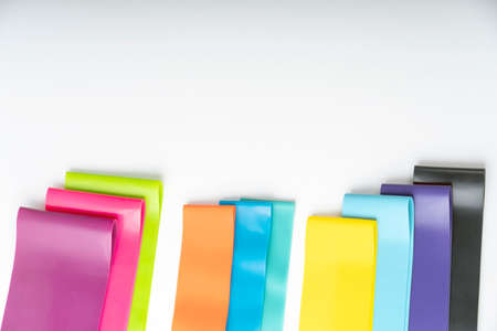 A set of colorful elastic fitness land. Expanders for women