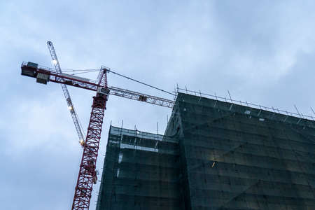 construction work of houses at night, Crane loader At night On the construction site