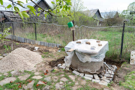 old village well, repair, restoration and cleaning of a wooden wellの写真素材