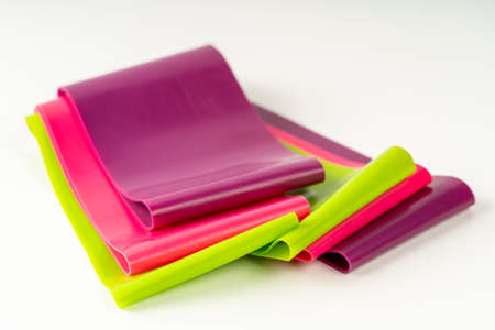 A set of colorful elastic fitness land. Expanders for women
