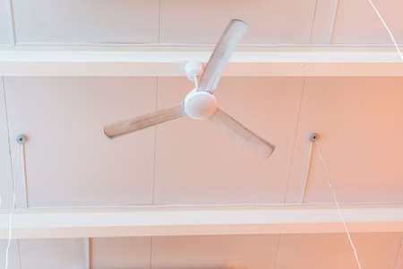 ceiling fan in a cafe, interior ceiling fan decoration at home in hot summer,の写真素材