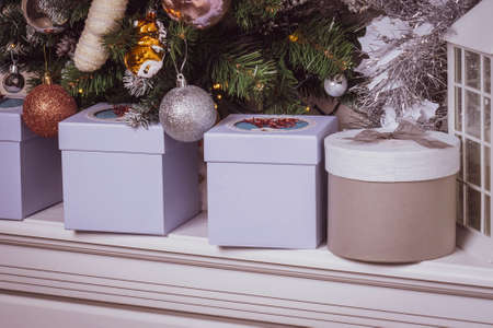 beautiful Christmas gifts under the Christmas tree, square and round gift boxesの写真素材