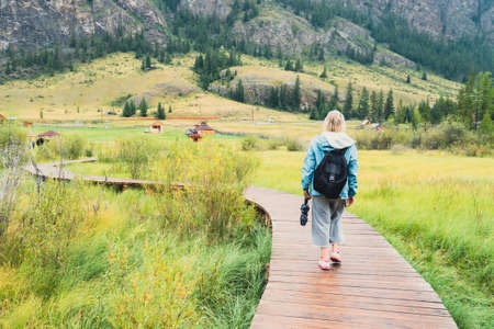 a wooden path through the swamp. Active recreation in the fresh air.の写真素材