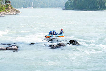 One raft with a group of tourists on the Katun River,