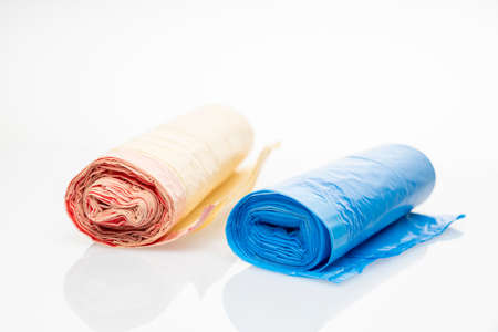 io-bags, biodegradable bags, multi-colored garbage bags on a white background