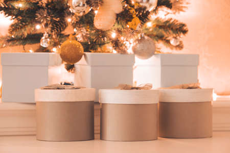 beautiful Christmas gifts under the Christmas tree, square and round gift boxes