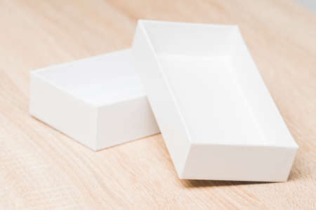 smartphone box, a package of products from a smartphone store. on the table is an empty white box from under the new smartphone, selective focus, tinted imageの写真素材