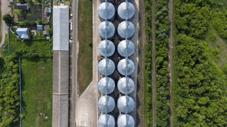 silo elevator, a view from a height, a modern grain storage elevator and a seed cleaning line. cleaning of agricultural products, flour, cereals and grains, Grain drying systemsの写真素材