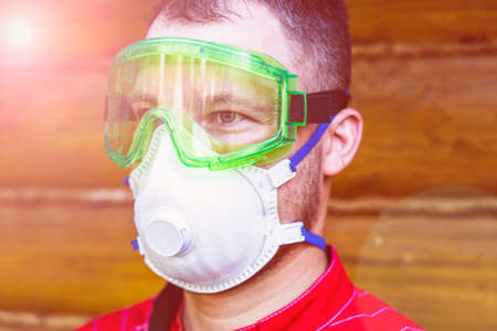 a man in overalls, a protective mask and a respiratorの写真素材