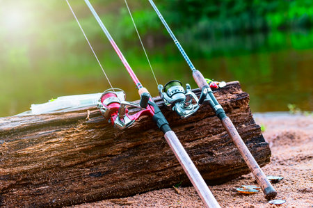 fishing gear on the shore. Two spinning rods andの写真素材