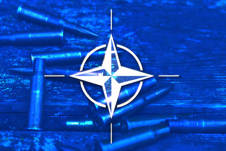 NATO flag against the background of ammunitionのeditorial素材