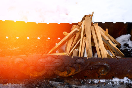 a stack of firewood in the grill prepared forの写真素材