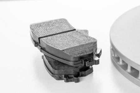 brake discs and pads on a white backgroundの写真素材