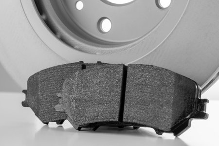 brake discs and pads on a white backgroundの写真素材