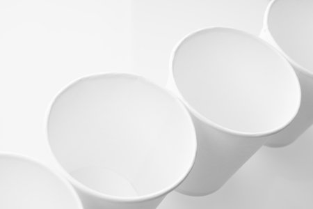 empty cardboard glasses close-up on a whiteの写真素材