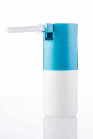 spray for sore throat blank for design, cylinder-shaped bottle on a white background, Spray bottle. high quality photoの写真素材