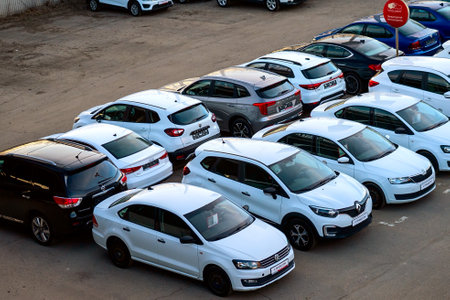Moscow April 10 2023, Parking of new cars near a car dealership, selective focus solar glare, image tintingのeditorial素材