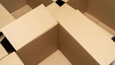 open cardboard boxes close-up, different angles, selective focus, cutout for handle in cardboard box