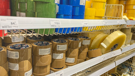 Moscow, March 02 2024, A store shelf with many different colored tape rolls. The tape rolls are in...