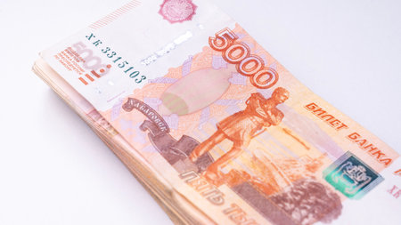 Stack of bills banknotes 5000 ruble notes on wooden texture table, one million cash money. Five thousand russian rubles banknotes for background. Exchange currency concept. Copy ad text space. High quality photoの写真素材