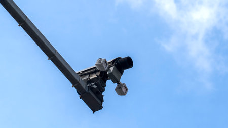 A video surveillance tool for a blue sky, security equipment. An outdoor video surveillance camera....