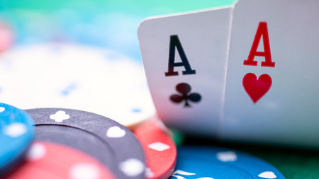 A poker player has two aces on the table. They have opened their cards and seen that they have two...