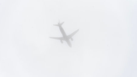 A passenger plane takes off in heavy fog. High quality photo