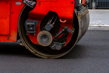 Asphalt paving restoration. Road construction machinery. Asphalt road roller on road construction. Road construction equipment. Vibrating roller on highway Asphalting. High quality photoの写真素材