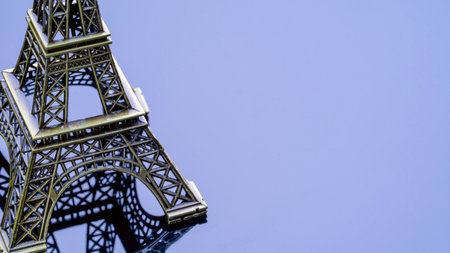A replica of the Eiffel Tower is located on a black, mirrored, reflective surface. On the right, there is a space for text and a blank area for your personal inscription. High quality photoの写真素材