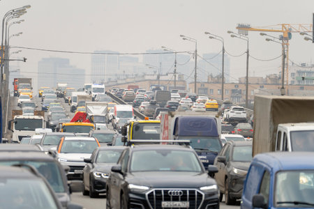 Moscow, March 12 2025, A busy street with a lot of traffic and a lot of cars. The cars are all...