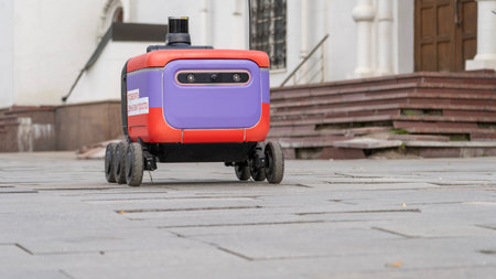 Moscow November 04 2025, Delivery robot wheels. Close-up of a delivery robot on a city street. High quality photoのeditorial素材