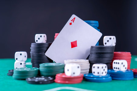 Dice cards chips. Gambling attributes. cards, dice, and playing chips on a green gaming table. High...