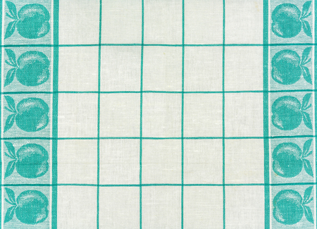 Texture of cotton fabric with strips of green and silhouette of applesの写真素材