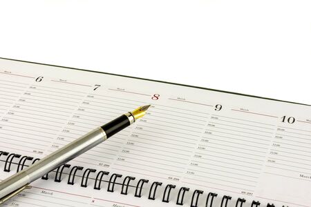Feather fountain pen indicates the date of March 8の写真素材