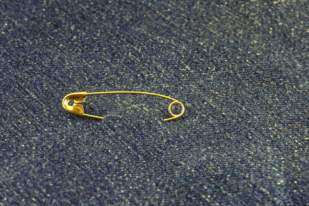 Metal pin buckle with hollow threaded through the blue denimの写真素材