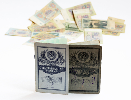 Savings books of the Soviet Union, are standing upright. In the background is seen the Soviet rubles without harshnessの写真素材