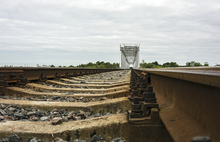 Rails and railway sleepers and railway bridgeの写真素材