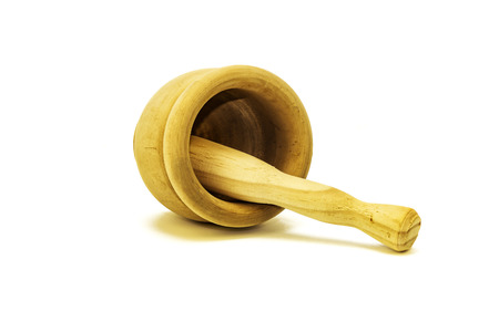 Wooden mortar for shredding various culinary ingredients on a white backgroundの写真素材