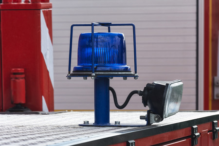 Flashing beacon of blue color with a spotlight for lighting in the dark