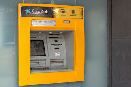 Tossa, Spain - 09/19/2017: through the Wall ATM for cash withdrawal. Stock photo.のeditorial素材
