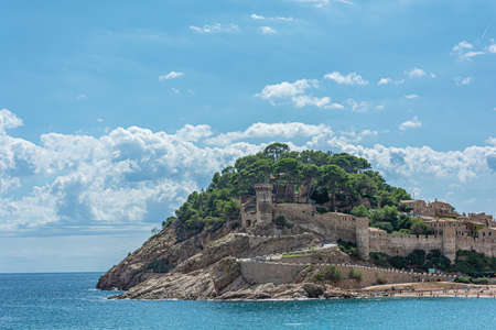 Tossa, Spain - 09/19/2017: the Old castle and fortress on the sea shore. Stock photo.のeditorial素材