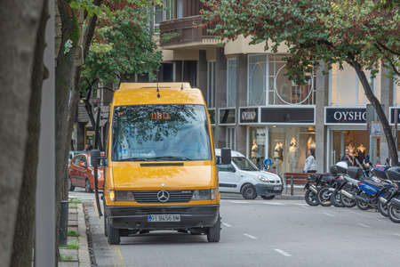 Girona, Spain - April 03, 2021: Minibus route on the city street. Stock photo.のeditorial素材