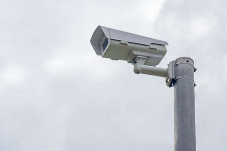 security camera is attached to a pole. Stock Photo