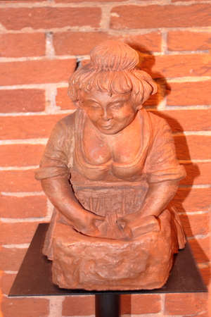 Traditional terracotta sculpture called 'pitocio' in use on the chimney-pots of the roofs as a lucky charm in the early 1900s.のeditorial素材