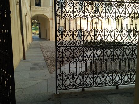 A gate in front of a buildingの写真素材