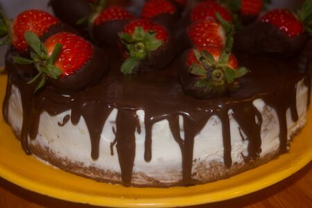cheese cake with fresh strawberries glazed in dark chocolate. Itの写真素材