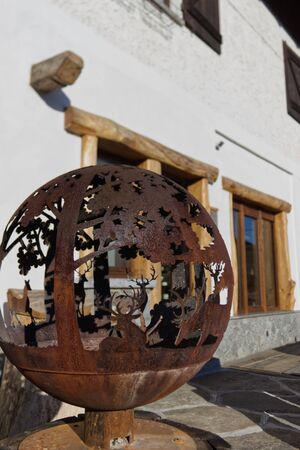wrought-iron sculpture depicting a mountain scene in a chaletの写真素材