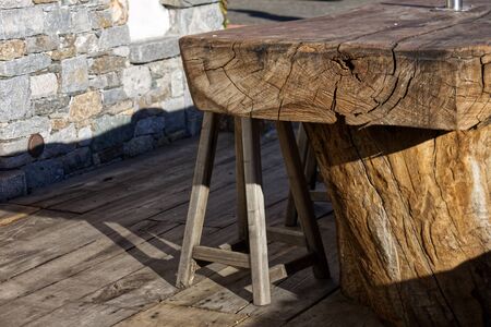 stool and tables made from a single wooden trunk in a cottageの写真素材